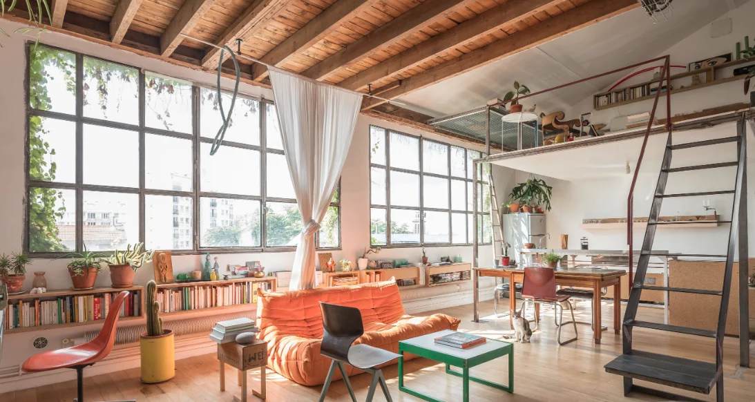 Architect’s loft with red structure and industrial glazing