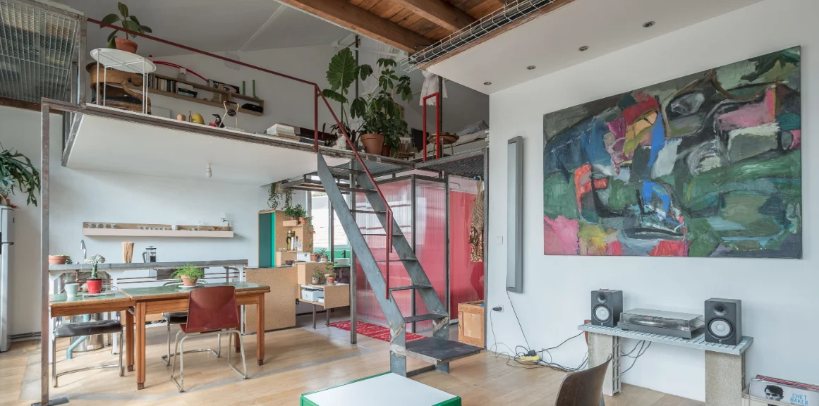 Architect’s loft with red structure and industrial glazing · 03