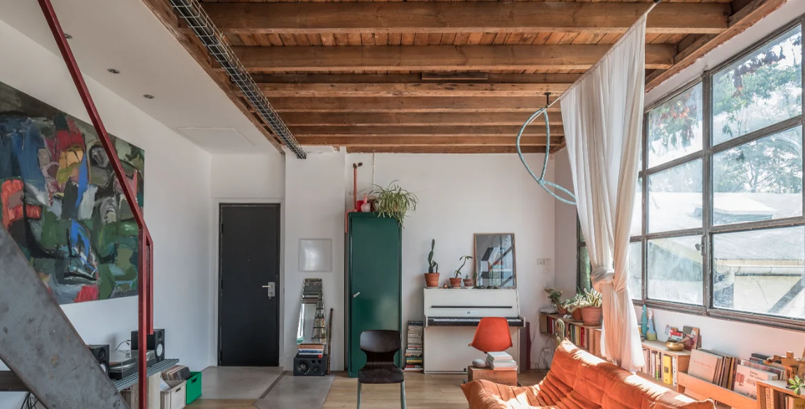 Architect’s loft with red structure and industrial glazing · 04