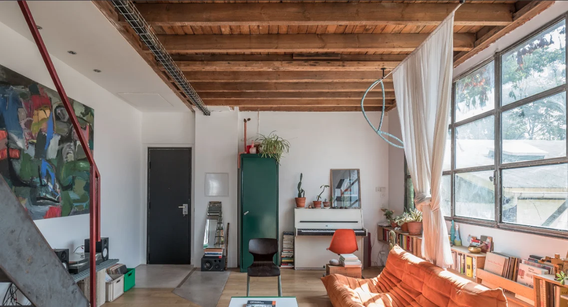 Architect’s loft with red structure and industrial glazing · 05