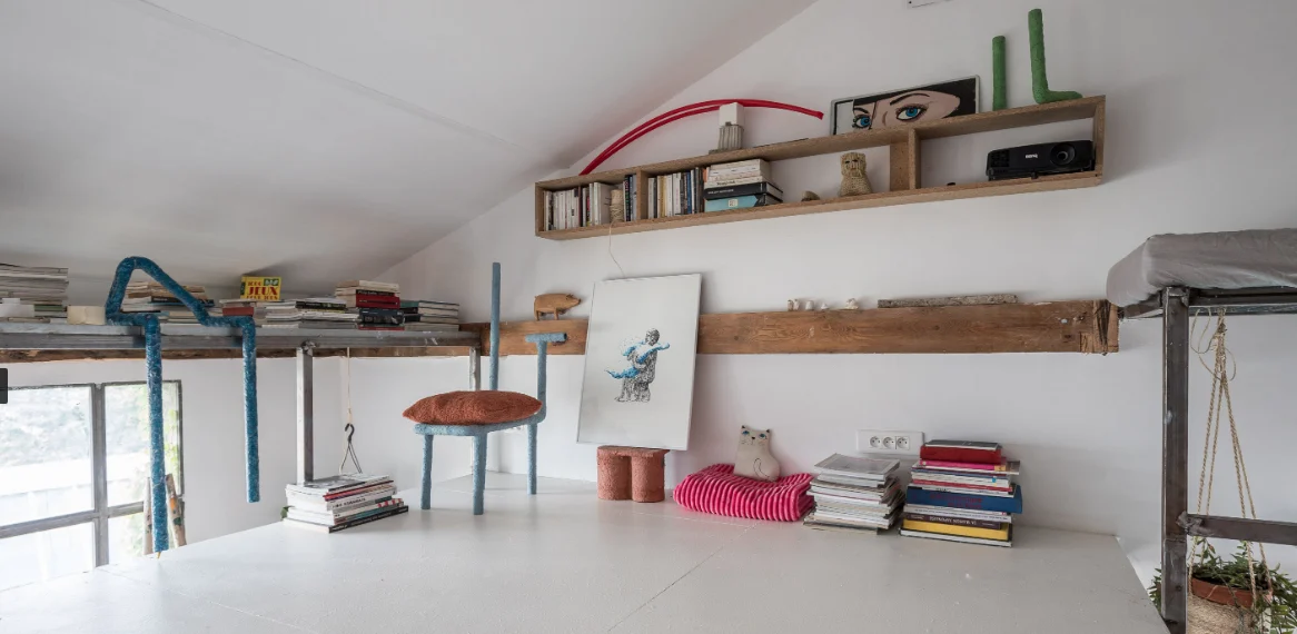 Architect’s loft with red structure and industrial glazing · 08