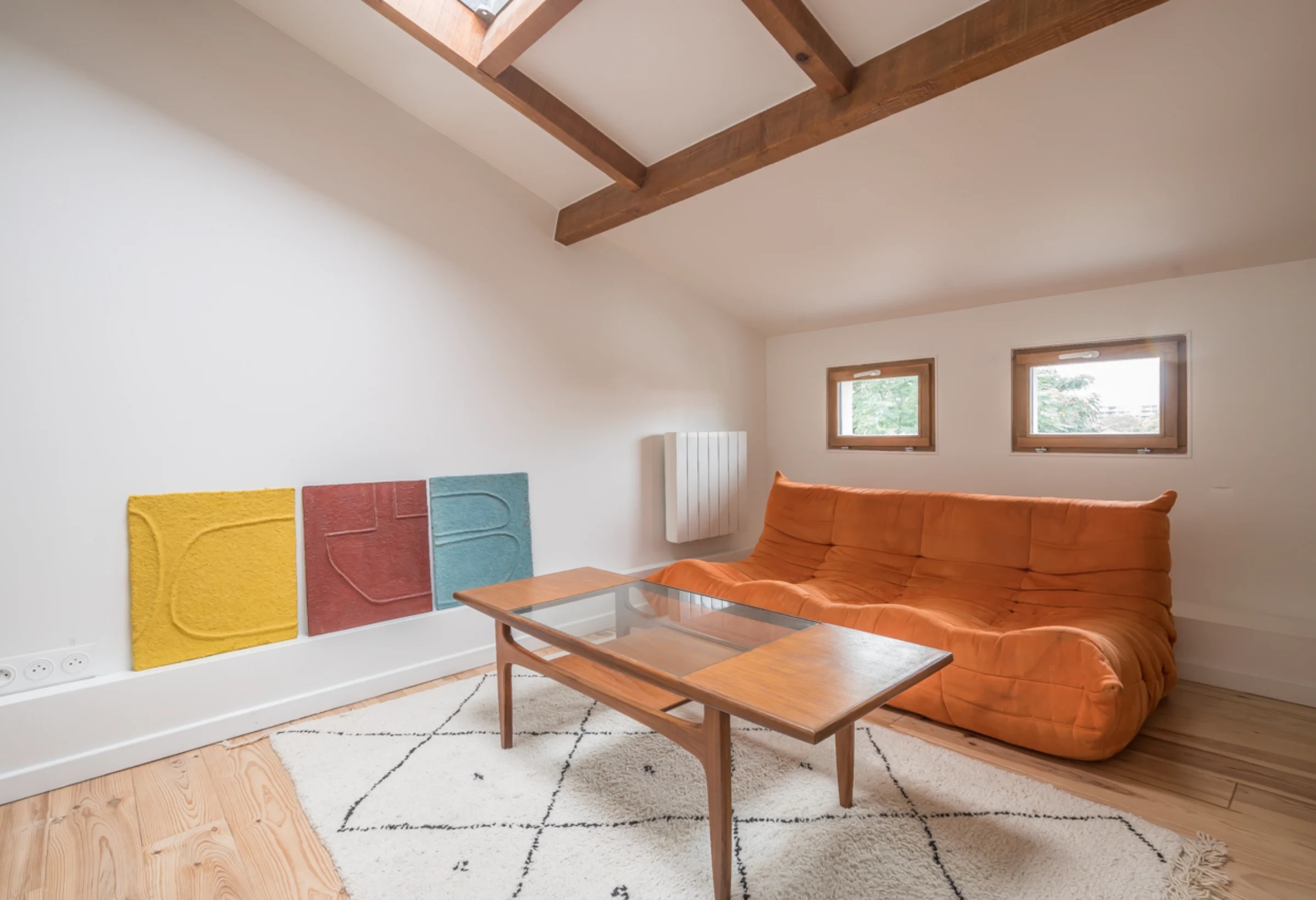 Attic studio with timber beams and mezzanine · 08